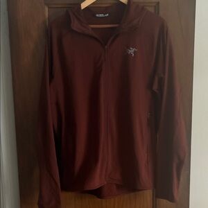 Arc'teryx Burgundy Adahy Zip-Up hoodie.